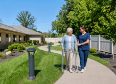 Two women walking down a sidewalk, one of them is using a cane. AI generated content