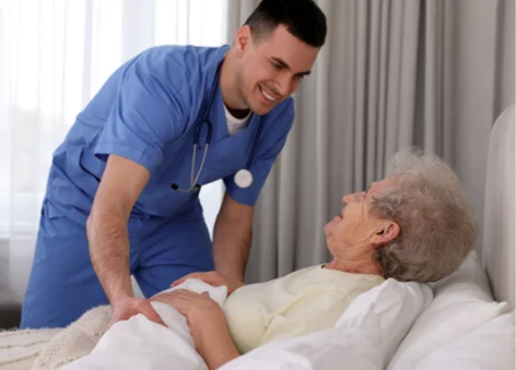 A man in a blue shirt is helping an elderly woman get into bed. AI generated content