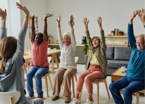 A group of people are sitting in chairs and raising their hands in the air. AI generated content